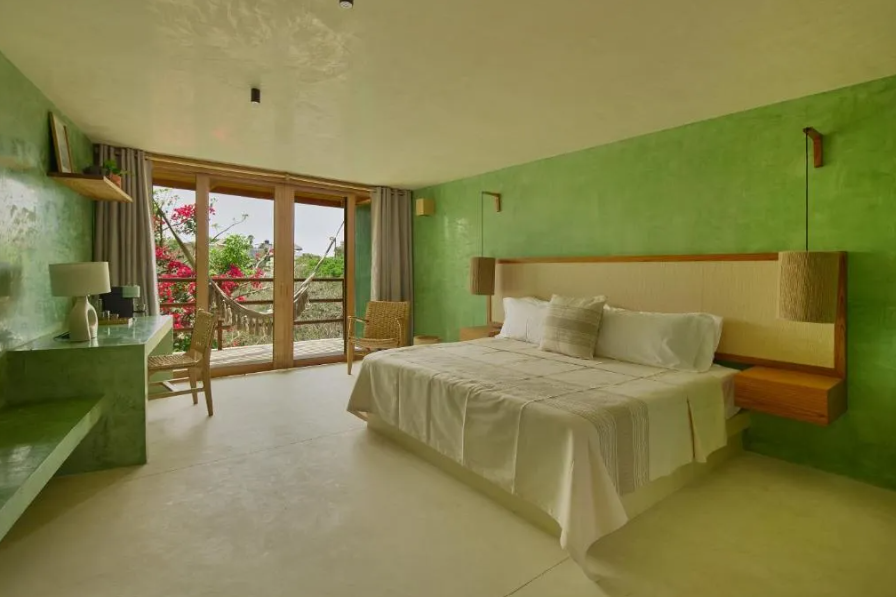 Punta Nayaá | Suite con cama grande y balcón